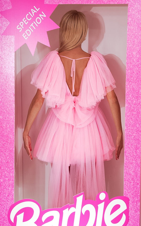 "Powder pink Cotton Candy Babe skater dress with tulle material and a bow at the back, ideal for birthday parties"
